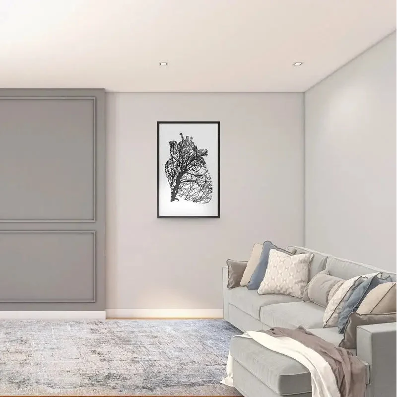 Modern living room with a gray door, plant, and sofa.