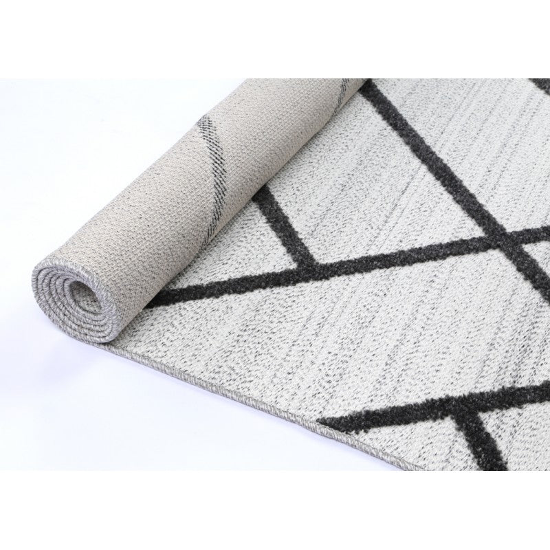 Archer Herring Rug Sand – rolled rug perspective