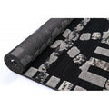 Archer Kasbah Rug Coal – rolled rug perspective
