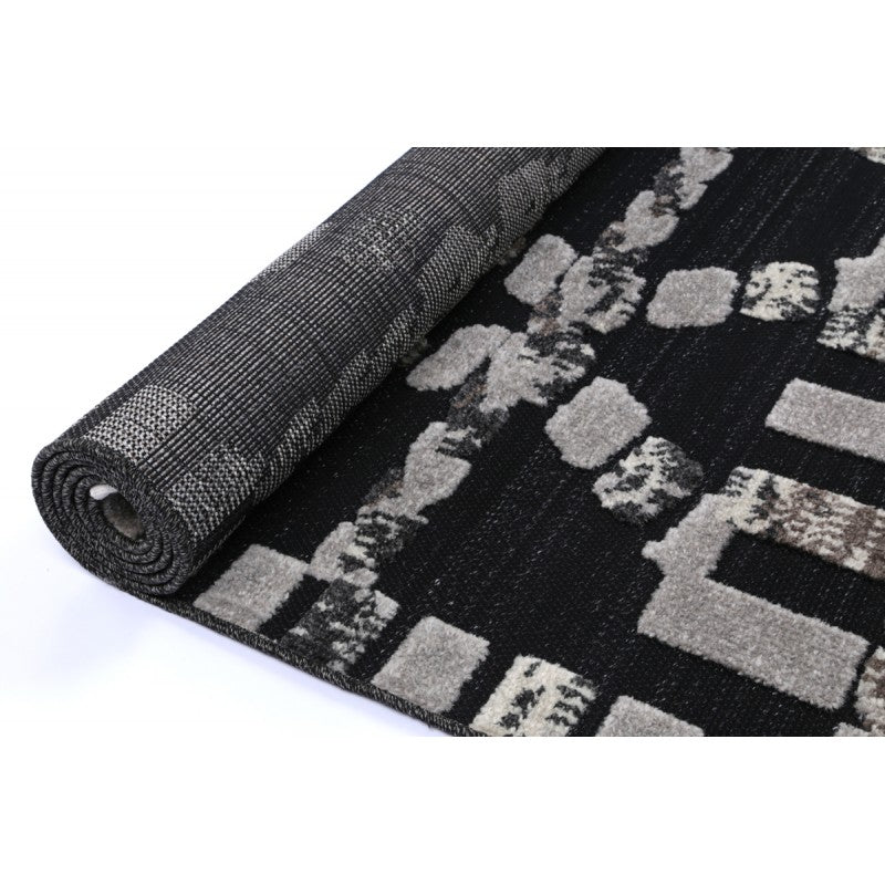 Archer Kasbah Rug Coal – rolled rug perspective